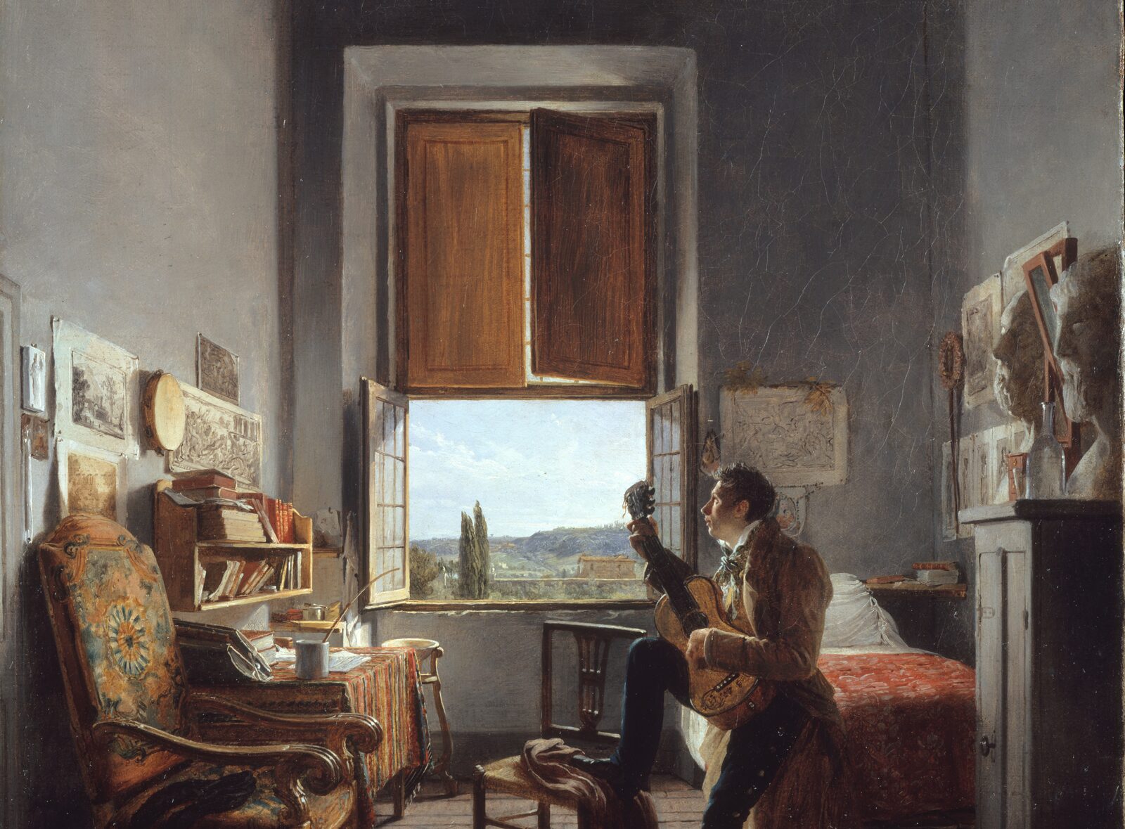 Oil painting of a tall, gray room in Rome. Wooden shutters stand open above a window onto green hills and cypress trees. On the left, a writing desk with books and papers; on the right, a young man in a brown coat tunes a guitar.